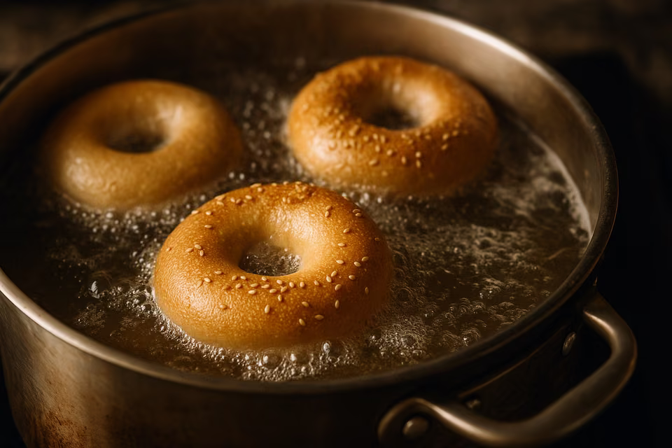 Bagels boiling in a kettle